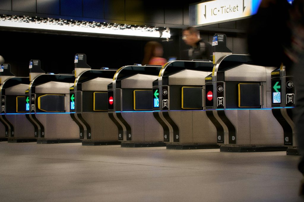 Row of ticket gates in a modern subway station